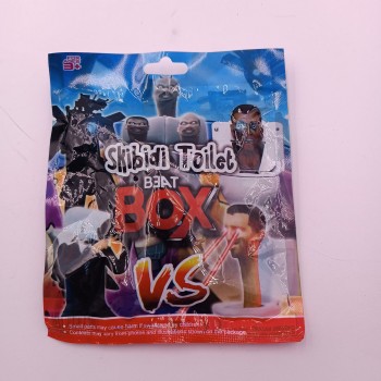 Plic Skibidi Toilet Beat Box, cu Figurina si Cartonase Surpriza, 9 cm